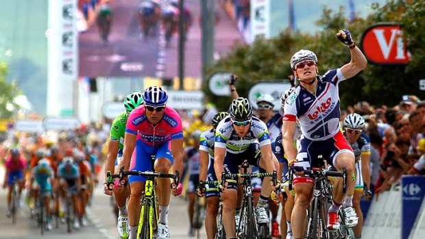 Andre Greipel (right) of Germany riding for Lotto-Belisol celebrates as he wins stage four of the 2012 Tour ahead of Alessandro Petacchi (left) of Italy and Matt Goss (centre) of Australia.