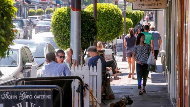 Still vibrant ... shoppers and cafe patrons along Malvern Road in Hawksburn Village.