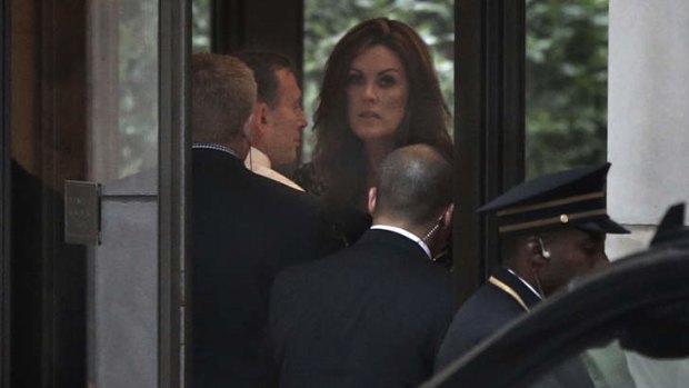Prime Minister Tony Abbott and his chief-of-staff Peta Credlin arrive in the lobby of Rupert Murdoch's Central Park apartment in New York for dinner with the media mogul.