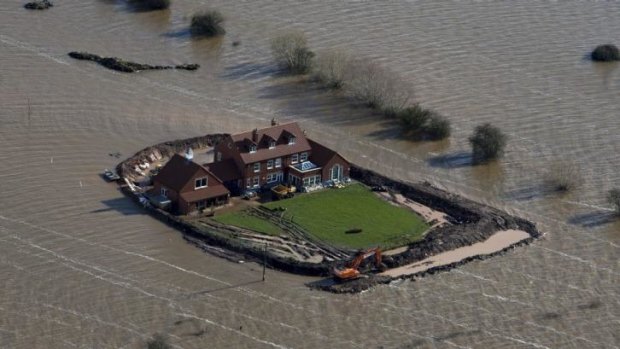 Inundated: A house near the flooded village of Moorland in Somerset, south-west England.