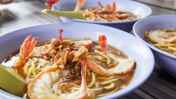 Hokkien soup prawn noodles bowls in a Singapore hawker stall.