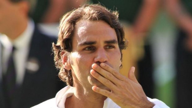 Federer blows a kiss to the crowd following his loss.