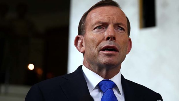 Prime Minister Tony Abbott addresses the media during a doorstop interview at his hotel in Port Moresby, during his visit to Papua New Guinea, on Sunday.