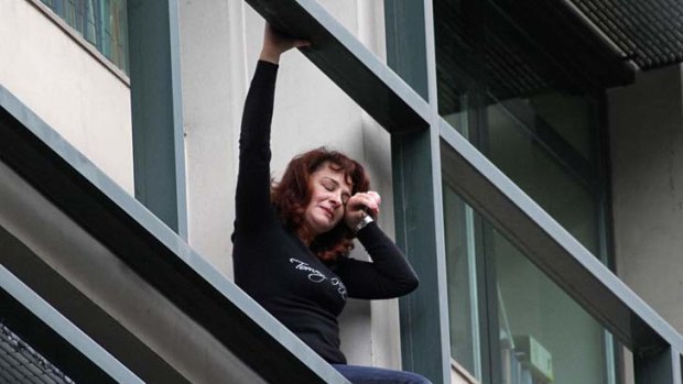 Hopeless ... Lambrousi Harikleia, faced with losing her job, threatens to jump from her office in Athens.