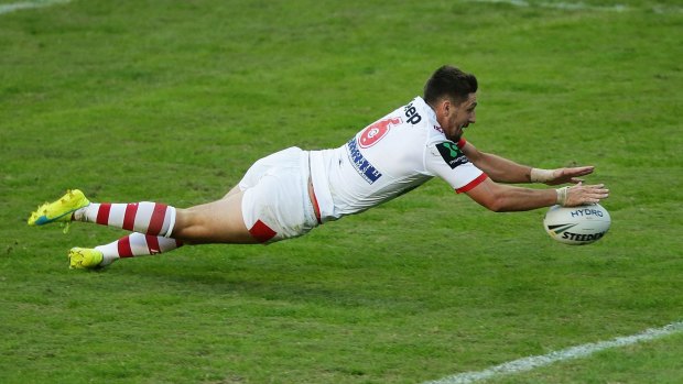 Gareth Widdop of the Dragons scores against the Roosters.