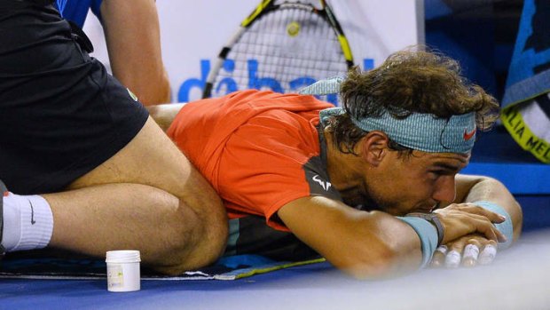 Tough tournament: Rafael Nadal receives treatment during the Open.