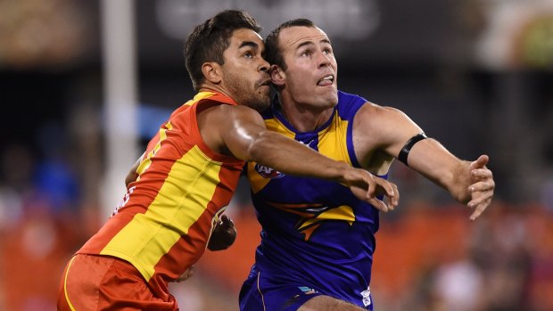 GOLD COAST, QUEENSLAND - AUGUST 01: Jack Martin of the Suns competes for the ball with Shannon Hurn of the Eagles during the round 18 AFL match between the Gold Coast Suns and the West Coast Eagles at Metricon Stadium on August 1, 2015 in Gold Coast, Australia.  (Photo by Matt Roberts/AFL Media/Getty Images)