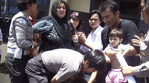 Crackdown ... Indonesian police round up Afghan immigrants.