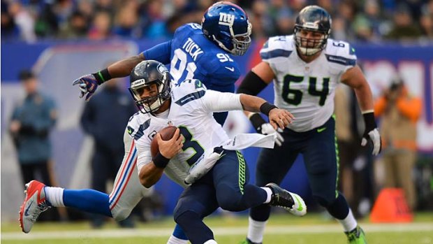 Quarterback Russell Wilson #3 of the Seattle Seahawks carries the ball during his team's 23-0 win over the New York Giants.