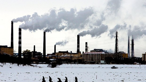 China is investing in wind and solar power, but factories such as these in the north-east Heilongjiang province caused a 13 per cent increase in  carbon emissions last year.