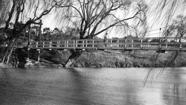 Bridging the gap: Gladys Waight on suspension bridge over Molonglo River and the Royal Canberra golf course circa 1926-1933.