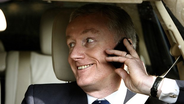 Stripped ... Fred Goodwin leaves the RBS's annual general meeting in a good mood in 2008.