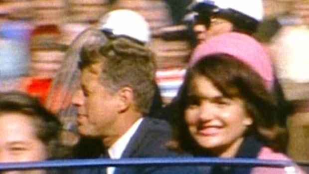 Moments from tragedy ... a home movie image shows   John and  Jacqueline Kennedy riding in a motorcade in Dallas, Texas, shortly before the US President was gunned down on November 22, 1963.
