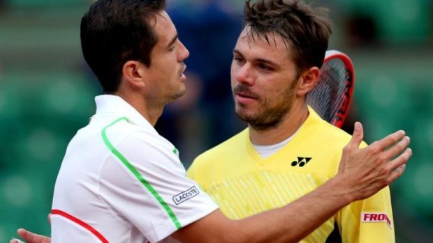 Shock exit: Stanislas Wawrinka of Switzerland shakes hands at the net with Guillermo Garcia-Lopez.