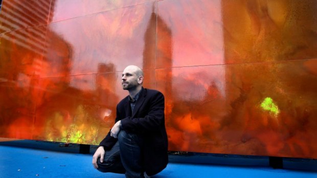 Artist Ash Keating with his mural, <i>Natural System Response</i>.