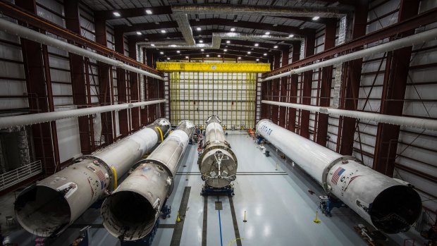 Recovered Falcon rocket boosters in a hangar at the Kennedy Space Center.