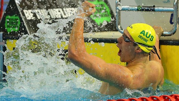 Punching: Grant Irvine celebrates his 200-metre butterfly final win.