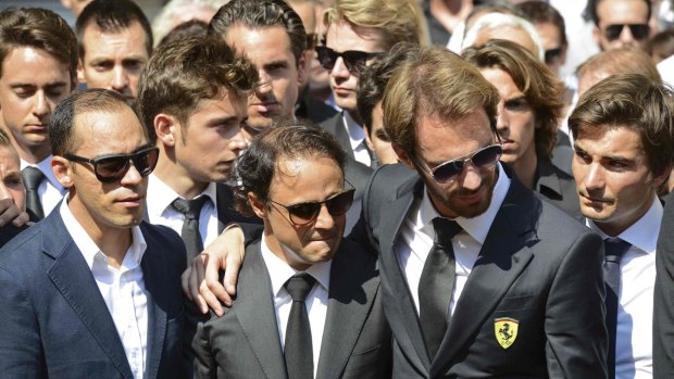Formula One drivers Jean-Eric Vergne (second from right) and Felipe Massa (second from left), friends and relatives gather around the coffin of late Marussia F1 driver Jules Bianchi during the funeral ceremony at the Sainte-Reparate Cathedral in Nice, France.