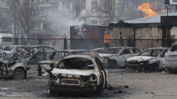 Burned cars in a residential area in Mariupol, Ukraine after a crowded open-air market came under rocket fire on Saturday morning.
