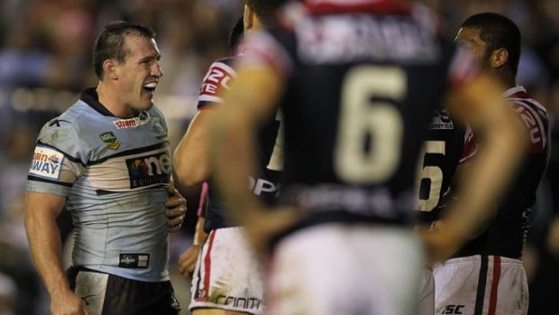 Standing up to the opposition: Cronulla captain Paul Gallen takes on the Roosters on Monday night.
