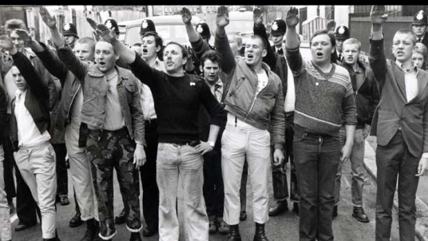 Pro-National Front marchers give the Nazi salute as they interrupt an anti-fascist rally in London’s East End in April 1979.