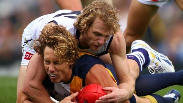 David Mundy of the Dockers tackles Eagle Matt Priddis during the western derby at Patersons Stadium on Sunday.