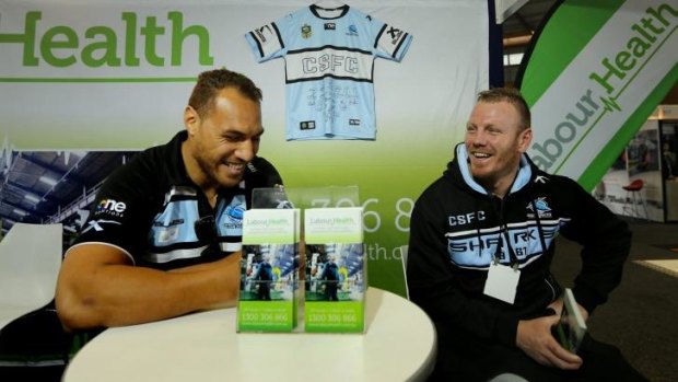 Safety first: Sam Tagataese and Luke Lewis promote their sponsor at Sydney Olympic Park on Thursday.
