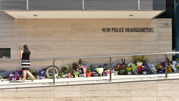 Flowers outside NSW Police headquarters in 2015, in tribute to Curtis Cheng.