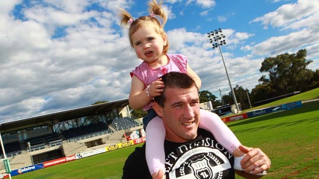 Daddy's girl . . . Cronulla's Paul Gallen enjoys time with  his two-year-old daughter, Charly, at Shark Park earlier this week.