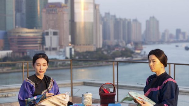 Stitching sisters: Actresses Gianna Jun (left) and Li Bingbing play dual roles in Wayne Wang's delicate arthouse drama  <i>Snow Flower and the Secret Fan</i>.