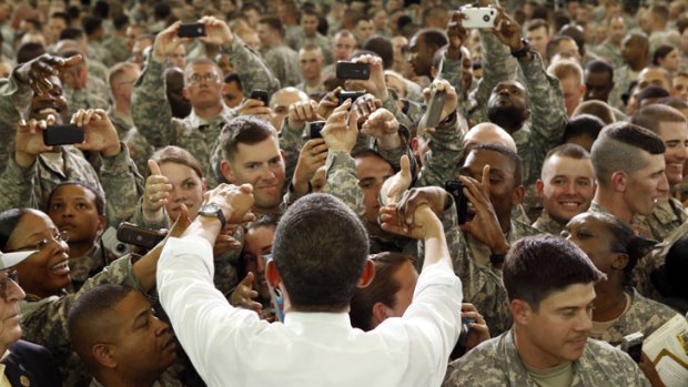 US President Barack Obama greets soldiers at Fort Campbell in Kentucky. He promised the soldiers - many of whom have served in Afghanistan - that al-Qaeda would be defeated.