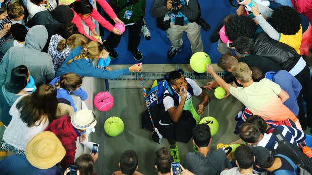 Nick Kyrgios is mobbed after his win at the Australian Open.