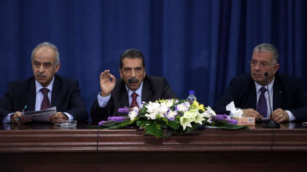 Inquiry: Tawfiq Tirawi (centre) speaks during a press conference in Ramallah.
