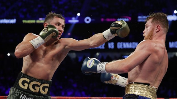 Gennady Golovkin, left, fights Canelo Alvarez during a middleweight title fight Saturday, Sept. 16, 2017, in Las Vegas. (AP Photo/John Locher)