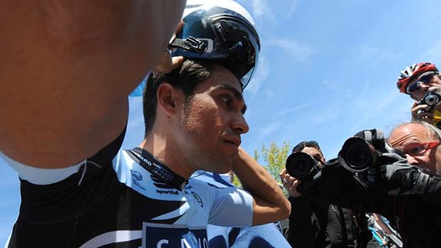 Alberto Contador puts his helmet on before a training session yesterday.