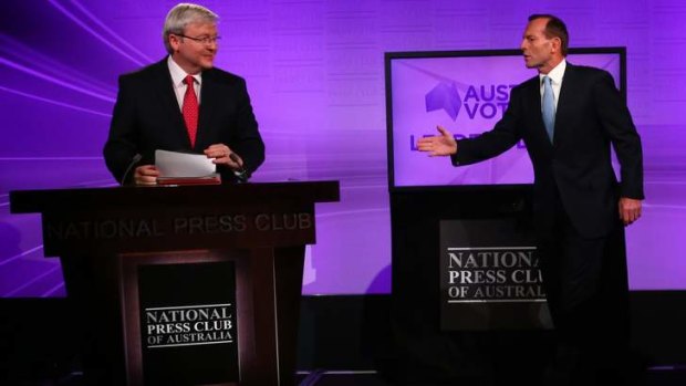 Opposition Leader Tony Abbott notices Prime Minister Kevin Rudd arrived with notes against the debate rules during the Leaders Debate at the National Press Club in Canberra on Sunday 11 August 2013. Photo: Andrew Meares