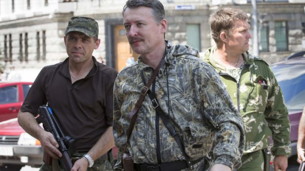 Igor Strelkov, a pro-Russian separatist commander, centre, arrives at a wedding in Donetsk, eastern Ukraine, in July.