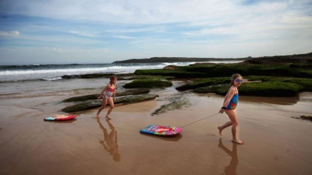 Keeping an eye out: Isla, 5, and Alicia, 6, at Maroubra Beach, where a shark was caught earlier this year.