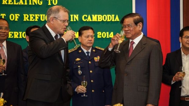 An awkward toast: Immigration Minister Scott Morrison and Cambodian Interior Minister Sar Kheng.