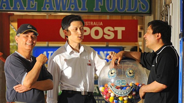 Asian Australians are taking on small businesses.Charcoal chicken owner Huaping "Peter" Tang, Aust Post Agent Wei and News agent Quin "Charlie" Zhou outside their shops in North Ringwood.