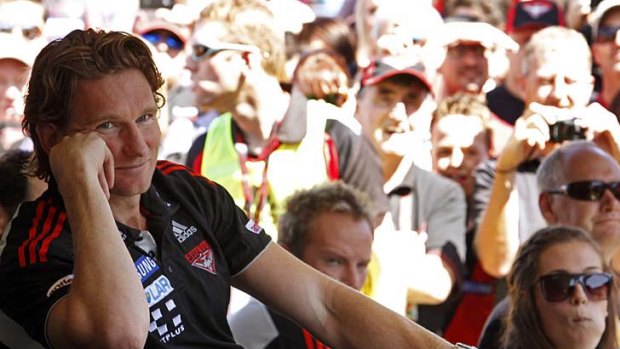Easy does it: James Hird looks relaxed at Essendon's family day at Windy Hill.