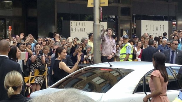 Princess Mary waves to the crowd outside the Ole Lynggaard store in Sydney.