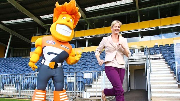 Giant beginning: GWS marketing manager Michelle Ahern and team mascot G-Man.