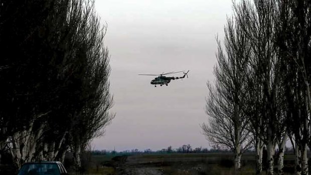 A Ukrainian army MI-8 military helicopter flies to the east.