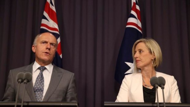 ACT Chief Minister Katy Gallagher and Federal Employment Minister Senator Eric Abetz announce a $1 billion federal loan to resolve the Mr Fluffy asbestos crisis in the ACT.