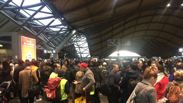 Stranded passengers at Southern Cross Station on Thursday. 