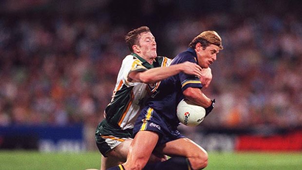 Jarlath Fallon chases down Shane Crawford in the first match of 1999.