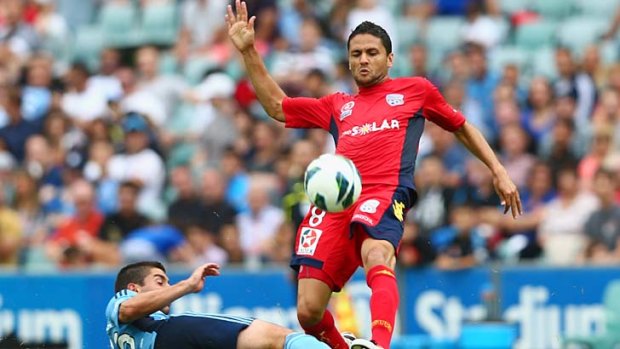 Tough: Sydney FC's Joel Chianese tackles Adelaide United's Marcelo Carrusca.