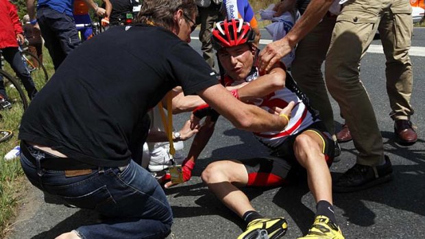 Ouch: Yaroslav Popovych of Ukraine feels the pain of a spill in the tour.