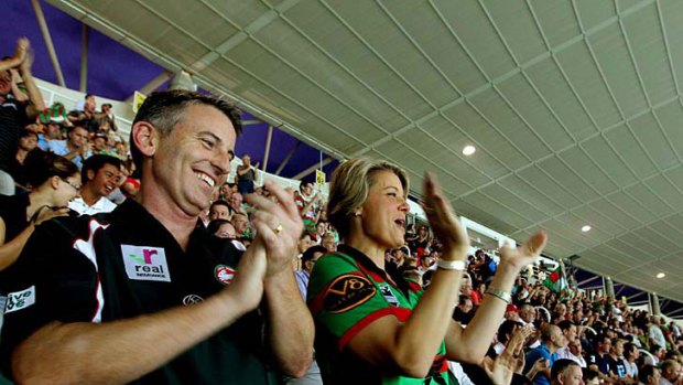 Bunny good time ... Premier Kristina Keneally and husband Ben applaud the Rabbitohs at last night’s match against the Roosters.
